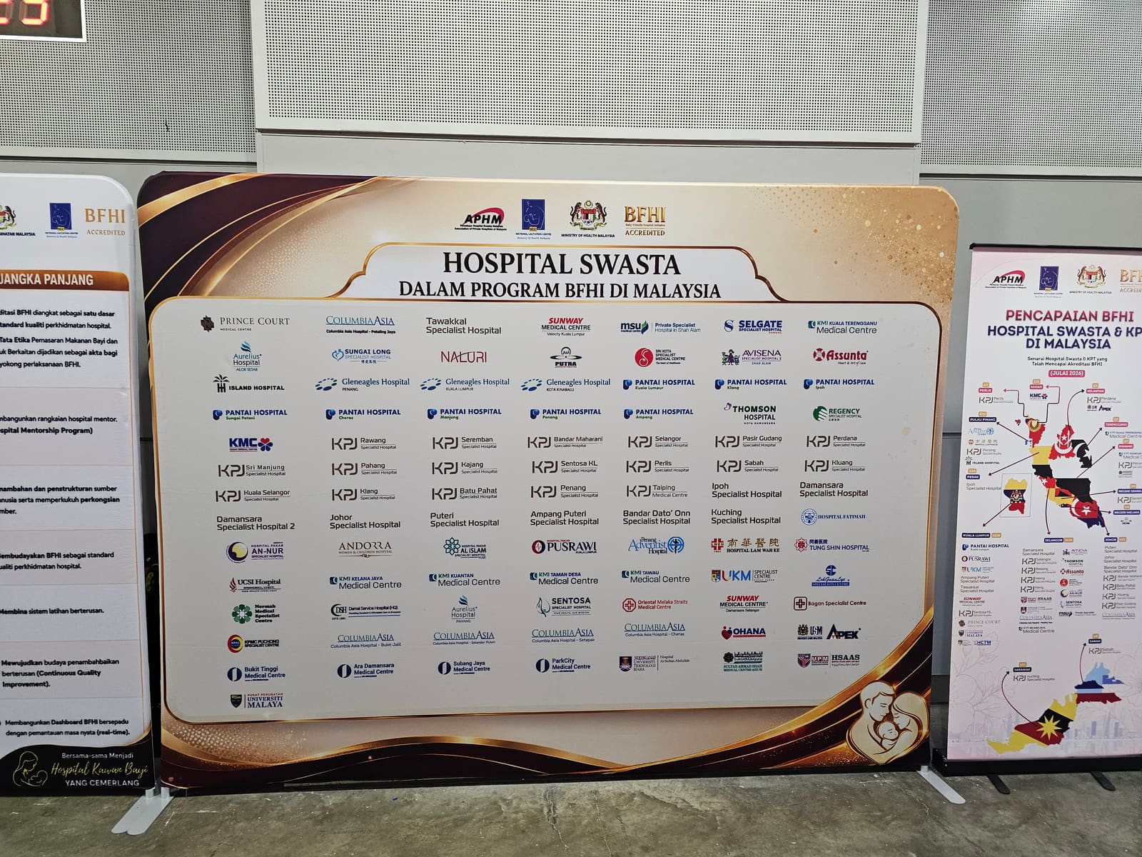 APHM 2026 display board listing Malaysian private hospitals participating in the Baby-Friendly Hospital Initiative BFHI programme — MedicalMet