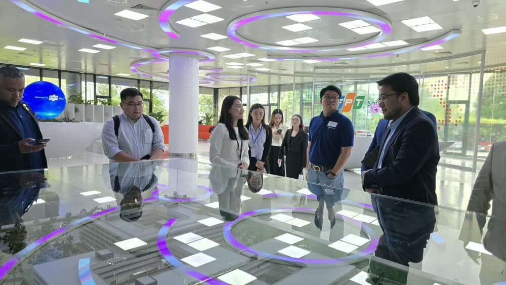 MedicalMet team touring the FPT Software campus scale model in Ho Chi Minh City, Vietnam