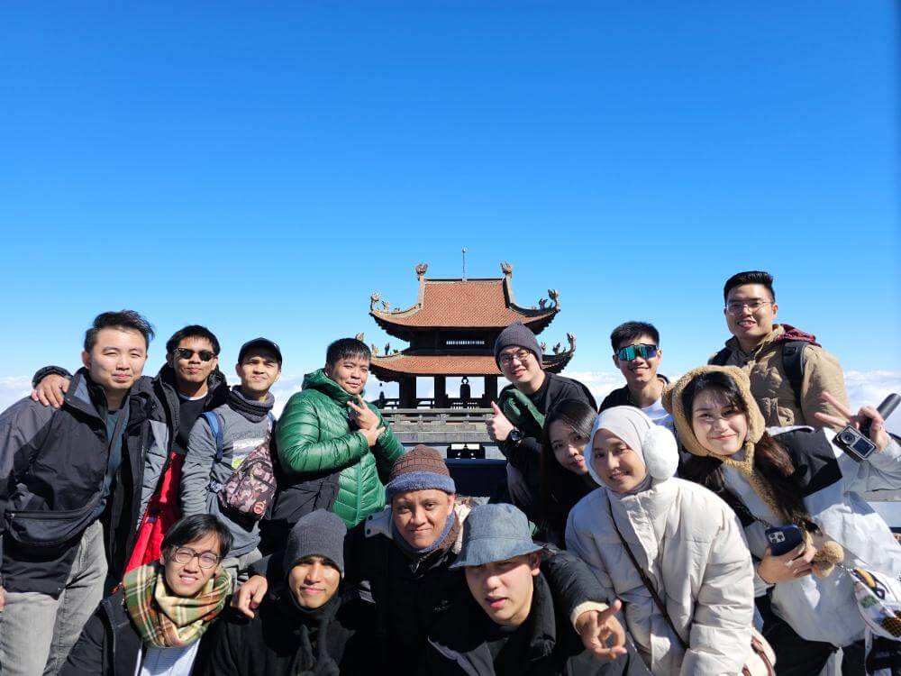 The MedicalMet team at the Fansipan summit on the company trip to Sapa, Vietnam